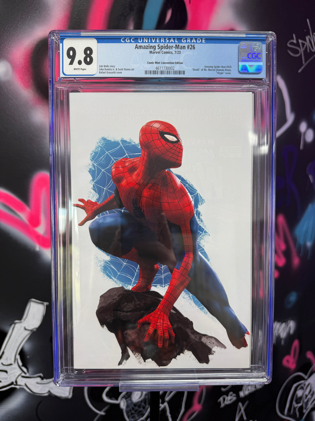 Comic book cover of Spider-Man with CGC grading label against a colorful graffiti background